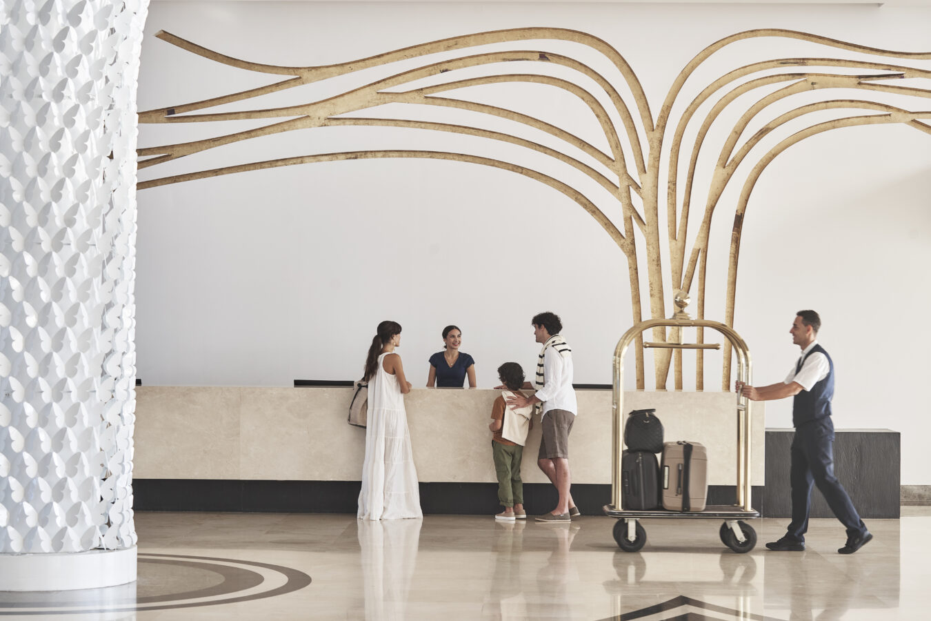 Family of three checking into Princess Andriana Resort & Spa for their Rhodes all-inclusive family holidays.