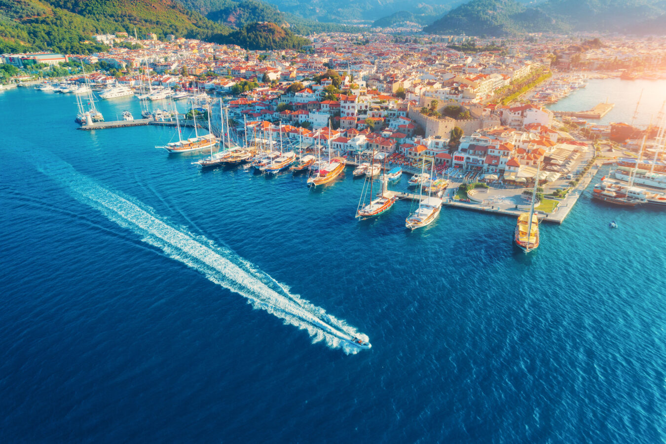 Aerial view of a boat on day trips from Rhodes to Turkey Marmaris town by H Hotels Collection.