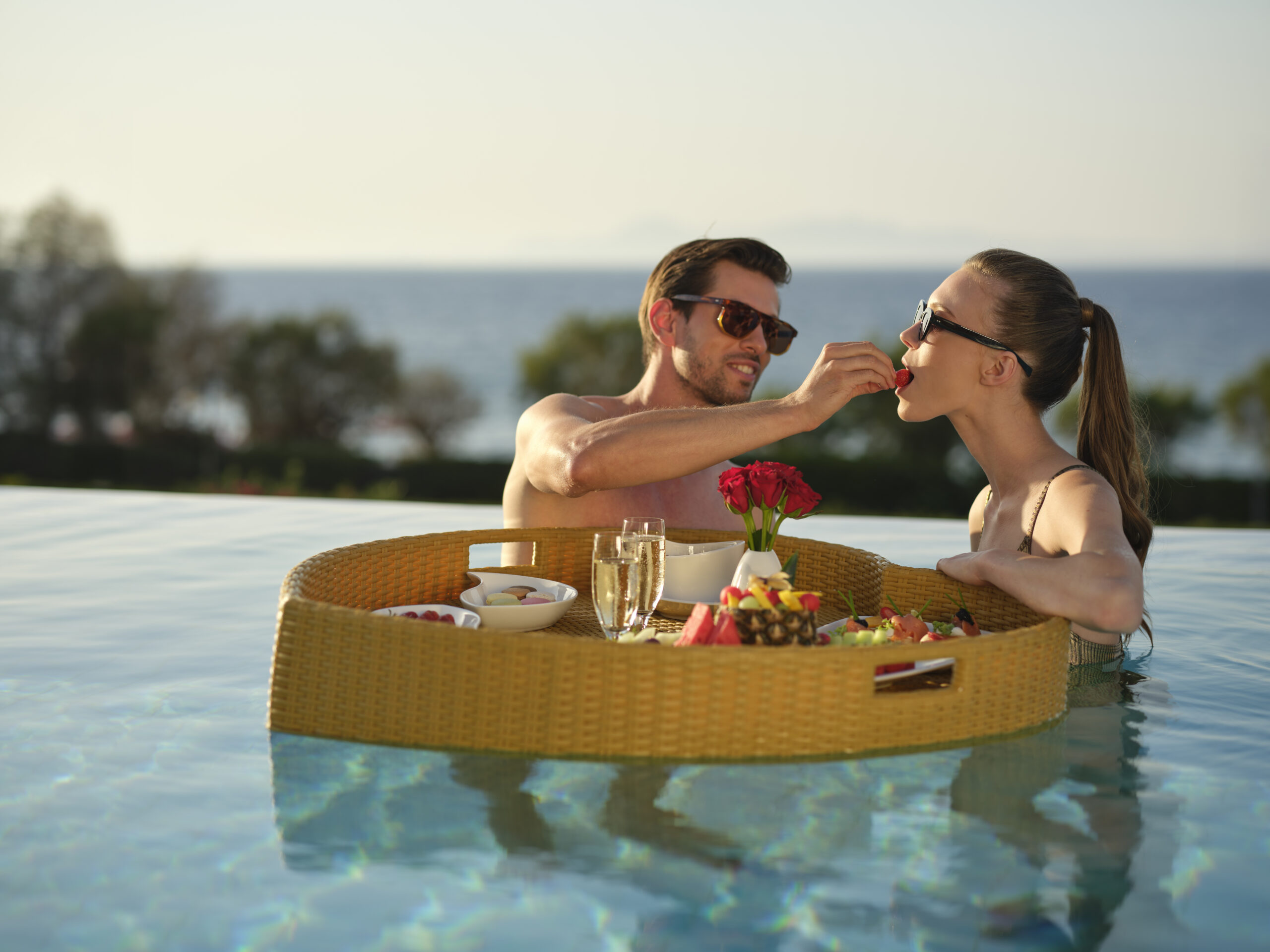 floating tray in the pool, couple
