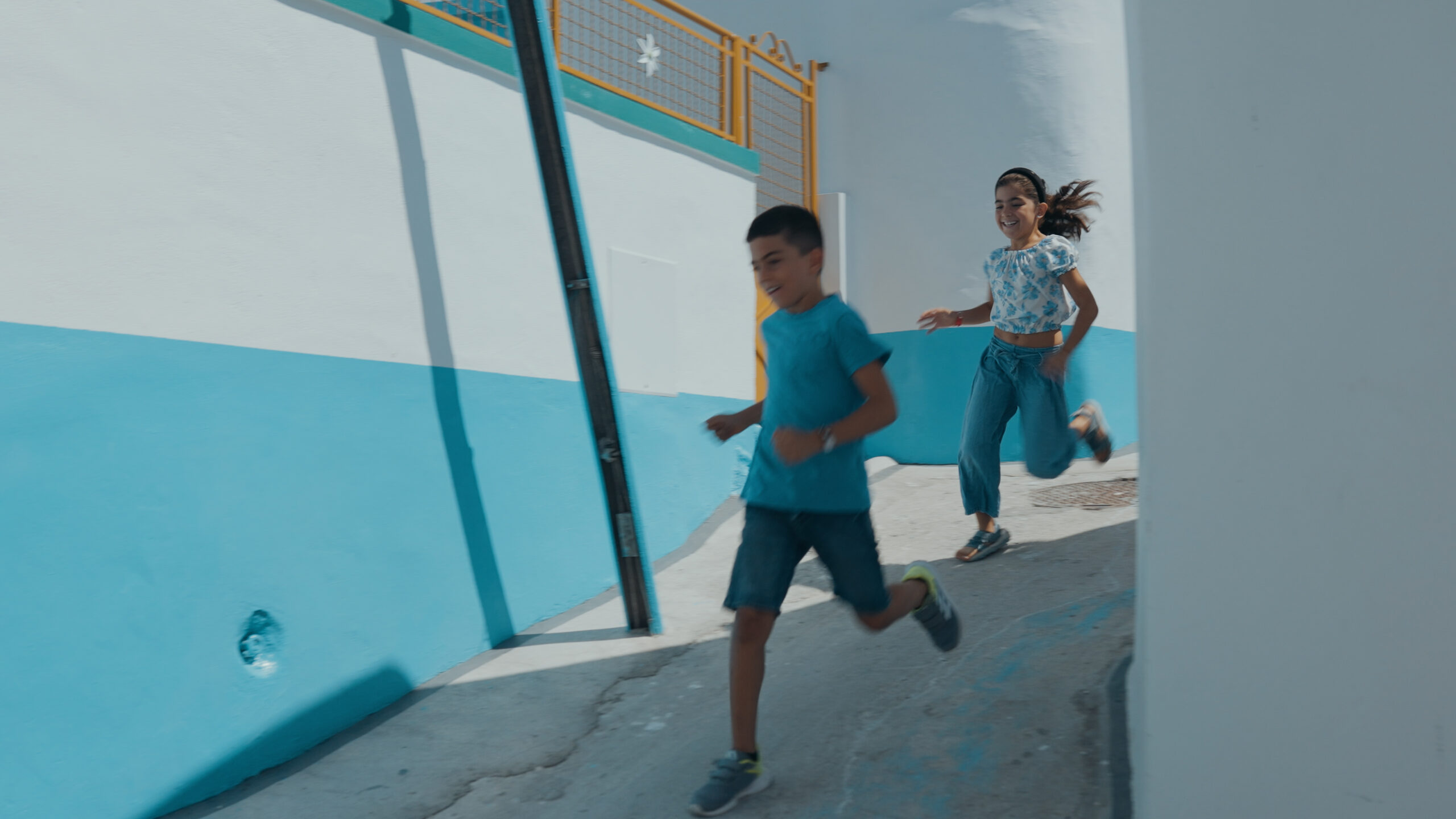the light we call home, aegean, 2 children playing in the village