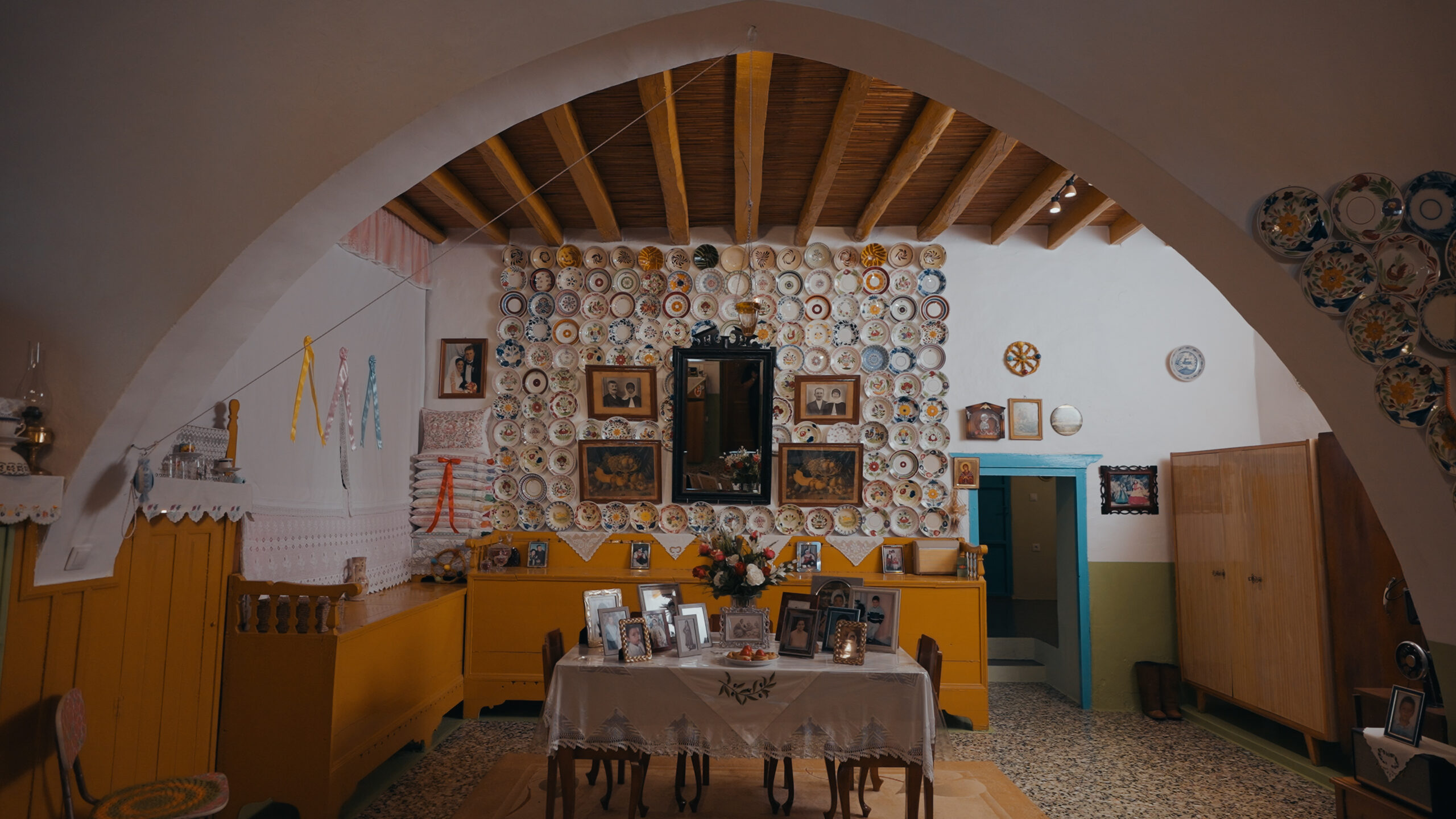 aegean, the light we call home, an old home with photos and objects of a family