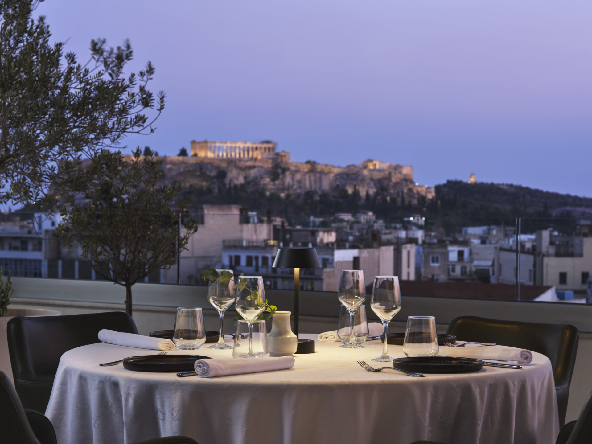 The rooftop ambiance with Acropolis views at Titania Hotel Athens, perfect for short stays in Athens capital. 