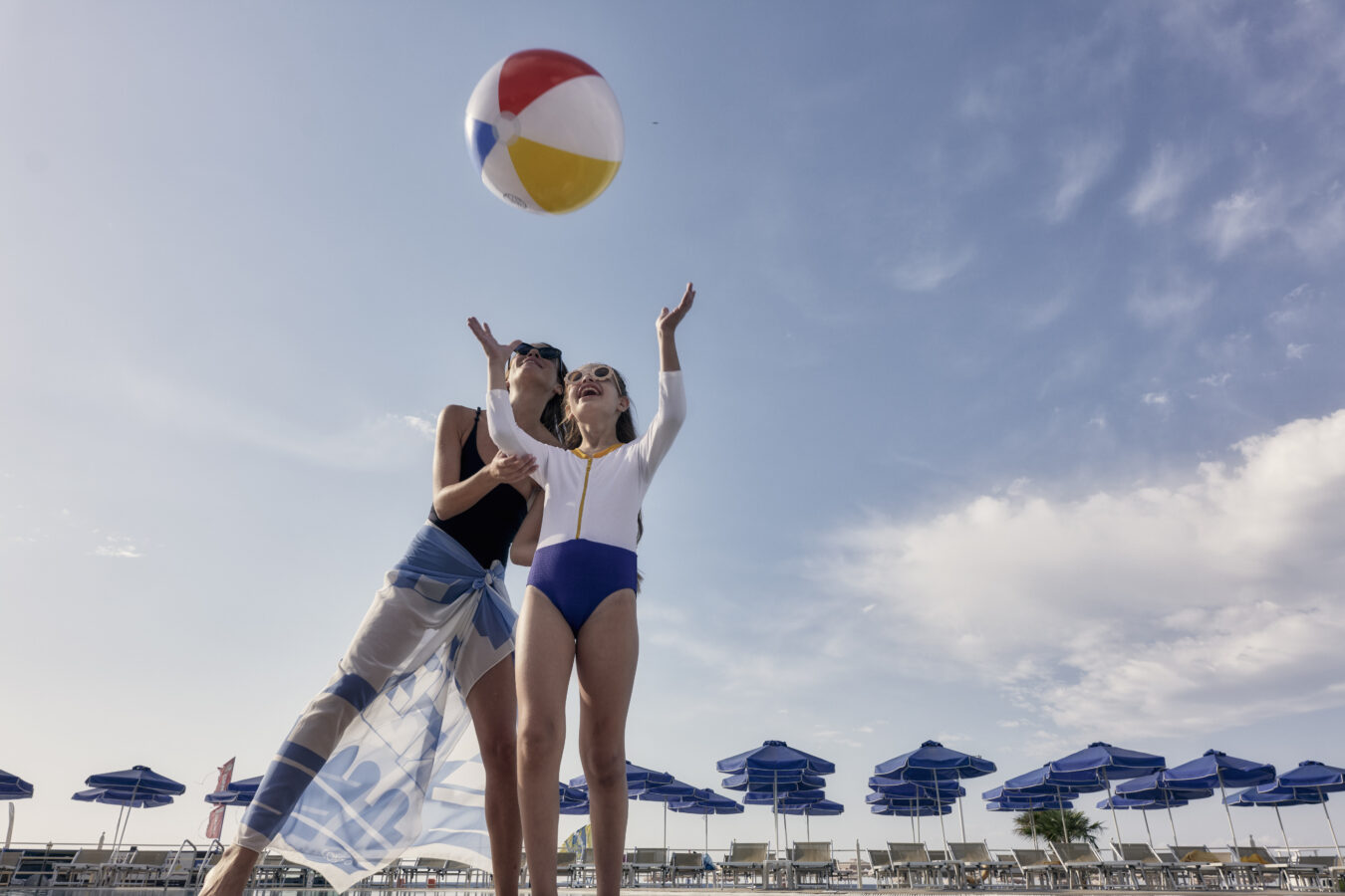 Mother and daughter enjoying the pool waterslides at Lindos Princess Beach Hotel, one of the best resorts in Rhodes for families.