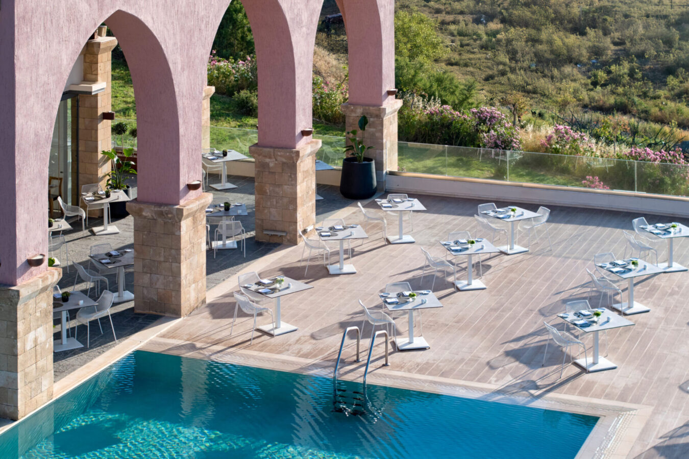 The main pool of the adults-only Boutique 5 Hotel & Spa by H Hotels Collection, one of the best five-star resorts for Autumn holidays in Rhodes island, Greece.