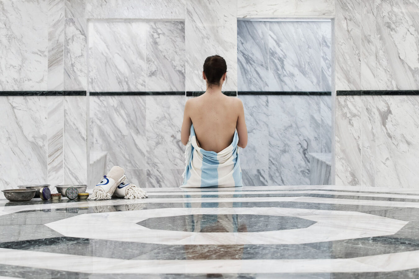 Female guest of H Hotels Collection enjoying the wellness benefits of Autumn spa breaks on Rhodes island.