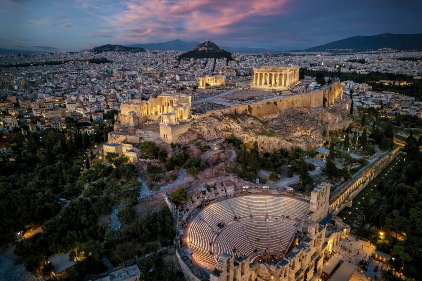 Evening view of Athens city center from above, showing the Acropolis and Odeon of Herodes Atticus, one of the best holiday destinations in November.