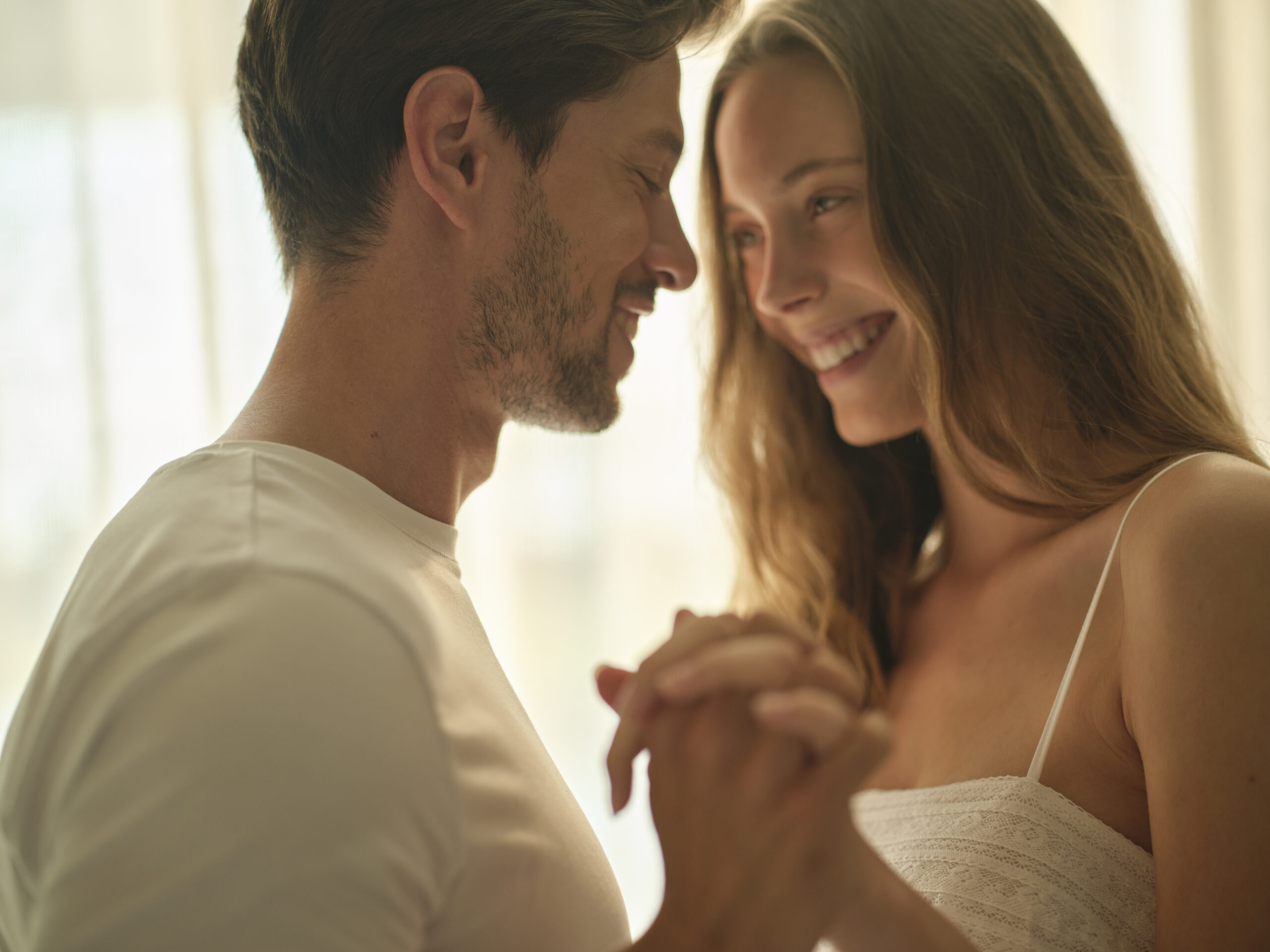 couple hugging in the room of the hotel
