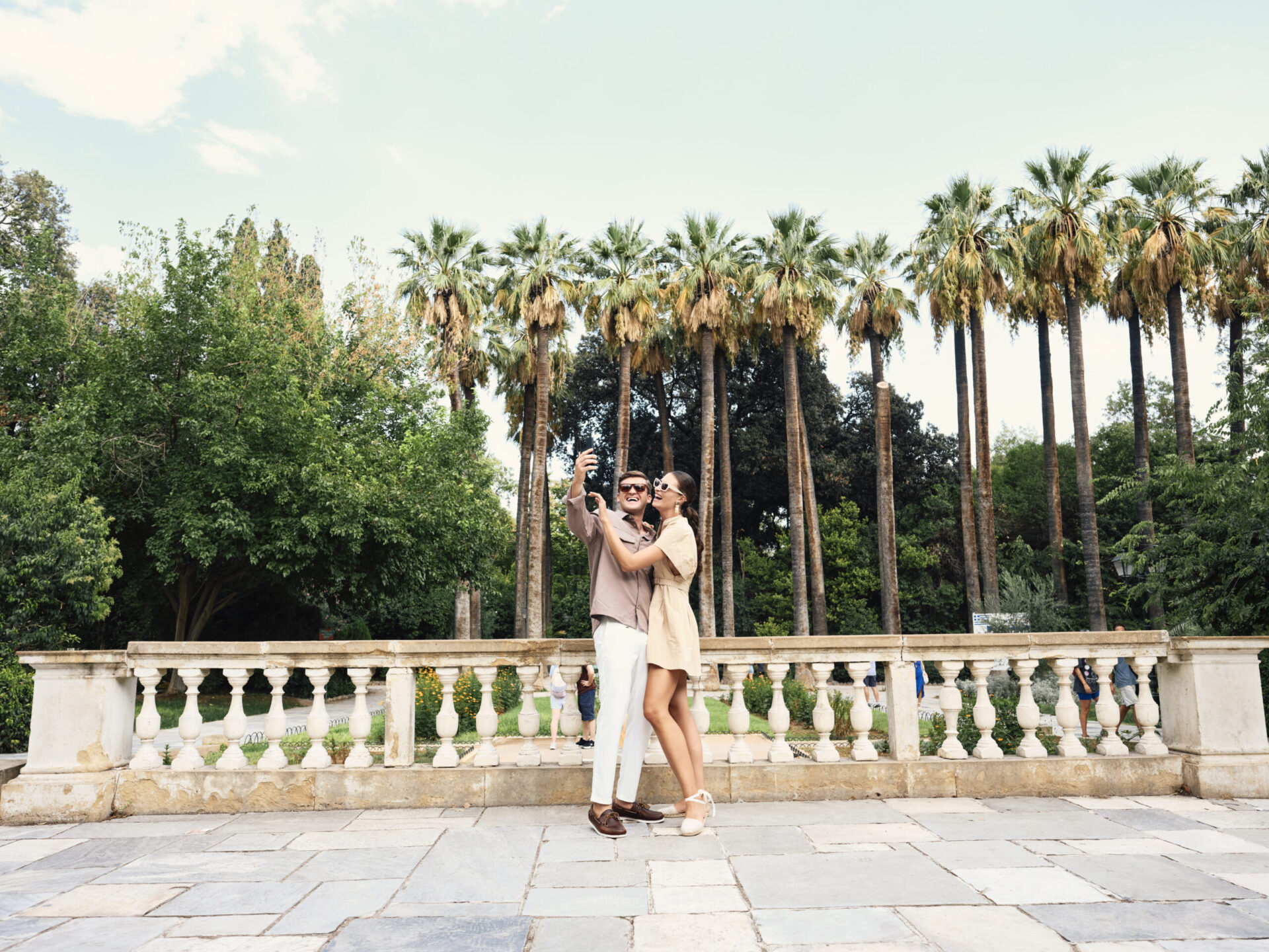 Couple taking a selfie at the National Garden in May, enjoying the wonderful weather in Athens.