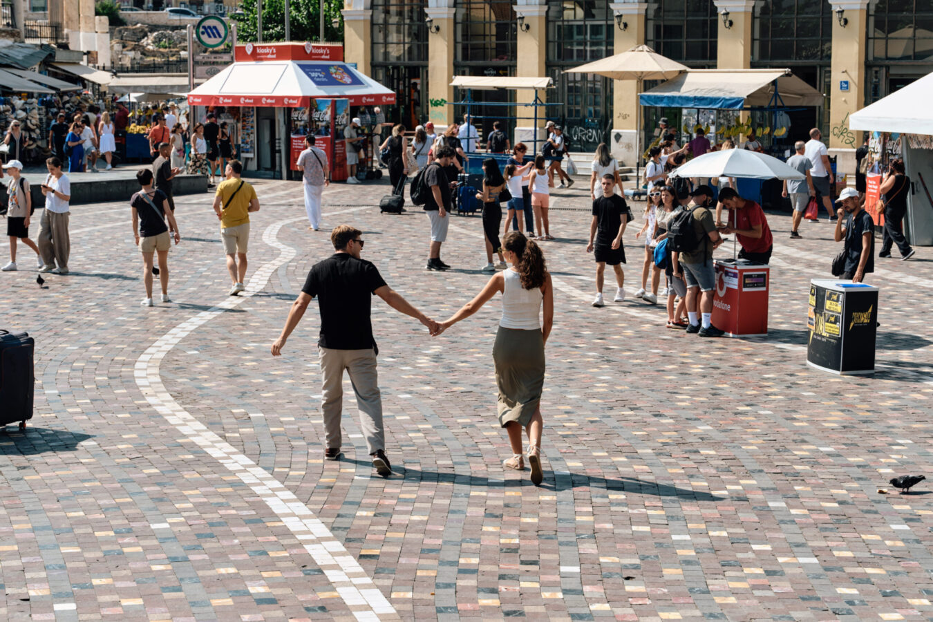 Happy couple pictured in Monastiraki Sqaure, one of the places to explore on a long weekend in Athens.